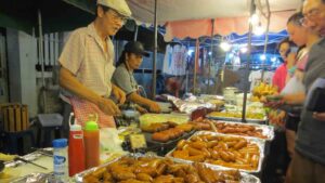 food vendor at chiang Mai Saturday Market - Top things to do in Chiang Mai thailand