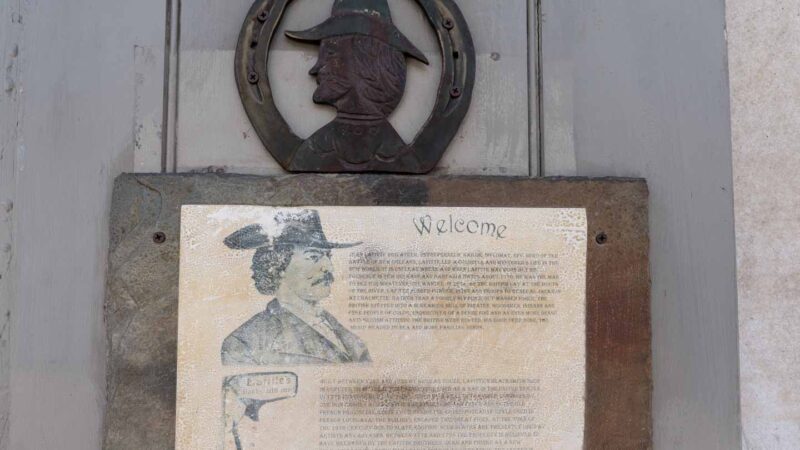 Sign posted outside Lafitte's Blacksmith shop in New Orleans with Jean Lafitte