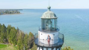 Woman stading on the top of Cana Island Lighthouse in Door County