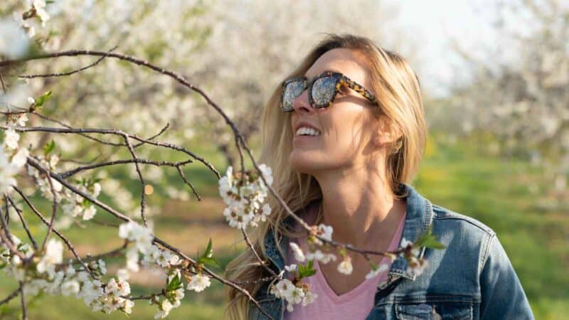 Woman with cherry blossoms in Door County - Things to do in the spring