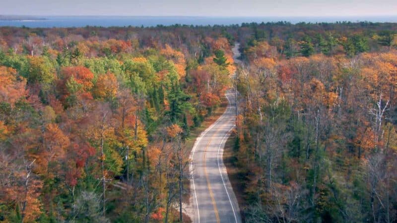 fall colors in Door County Wisconsin road with trees