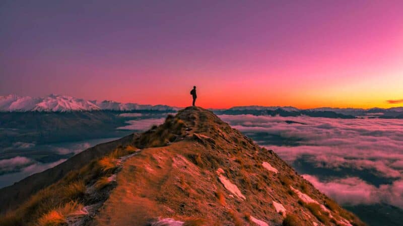 Man hiking to Roys Peak in New Zealand 