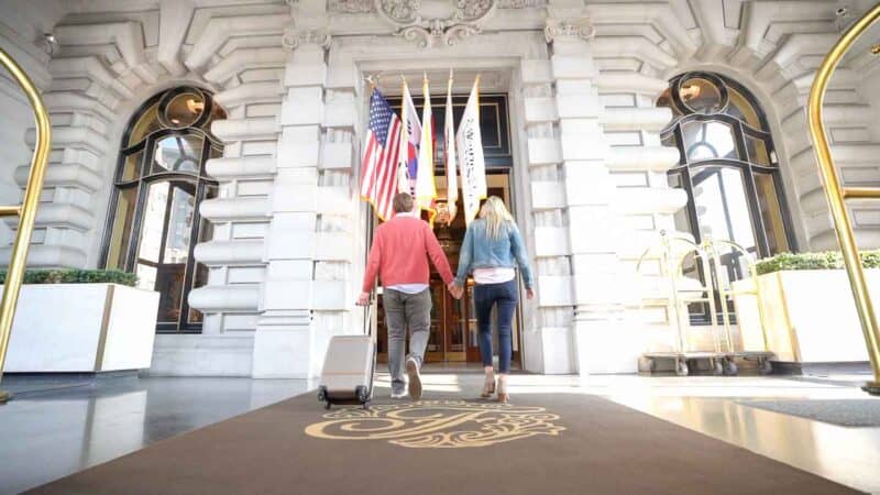 Couple walking into the Fairmont San Francisco - Weekend Getaway