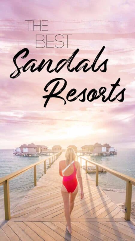 woman walking down the dock of bungalows at Sandals Resort - best sandals all inclusive