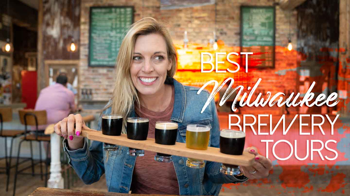 Woman holding a flight of beer samples at a Milwaukee Brewery Tour - Featured Image