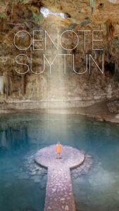 Pinterest pin for Cenote Suytun - woman standing inside the cenote with sunbeams