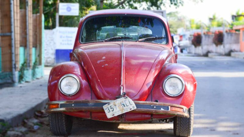 red vintage VW bug in Mexico - Understanding Car insurance in Cozumel Mexico Guide