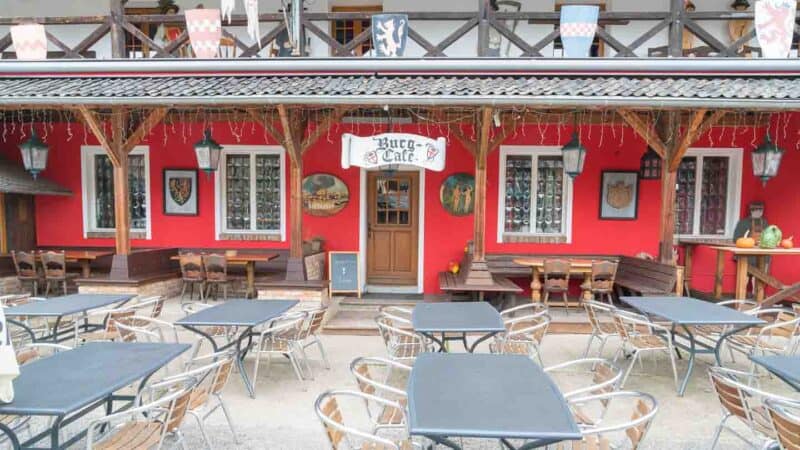 View of the red painted Burg Cafe inside the Burg Satzvey Castle