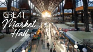 View from the top balcony of the Great Market Hall Budapest - sunlight flowing in and people walking - featured Image