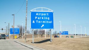 Blue sign with white letters for Milwaukee Airport Parking
