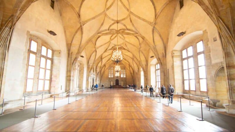 View down the long impressive hallway at the Old Royal Palace inside the Prague Castle during a tour