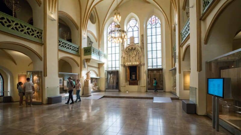 Interior view of the Prague Jewish Museum with large glass windows