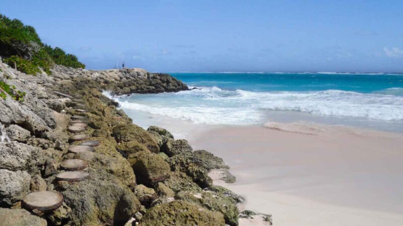 stone steps along the rocky edge of the pink sand beach in barbaods - Things to see in Barbados