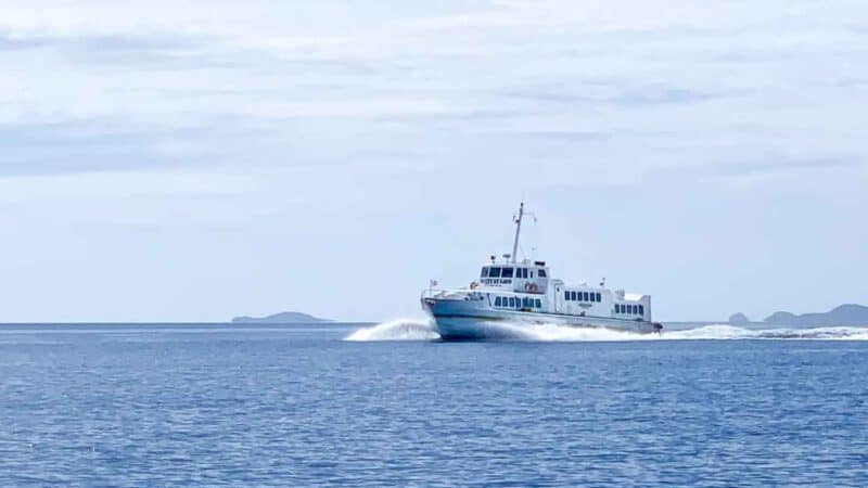 White Ferry boat traveling in the water between coron and El Nido Philippines