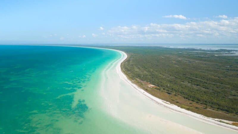 long strech of white sand on Isla Holbox Island Mexico