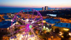 Aerial View of the Pier Park Skywheel with pink lights - Top things to do in Panama City Beach Florida