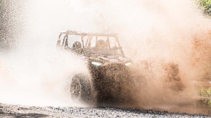 Big Puddles Polaris Adventures Bear Bogging ATV Rentals Wisconsin side view motion blur