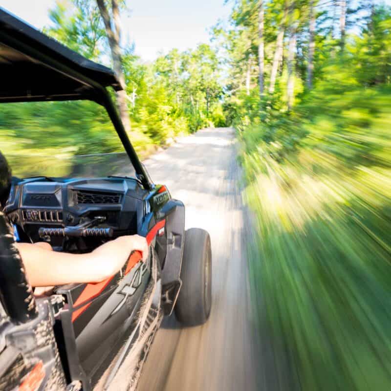 Polaris Adventures Bear Bogging ATV Rentals Wisconsin side view motion blur