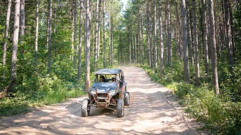 Tree Line Polaris Adventures Bear Bogging ATV Rentals Wisconsin side view motion blur
