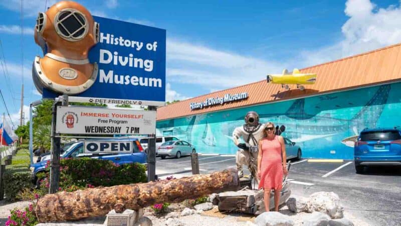 woman standing in front of the history of diving museum - Things to do on a Miami to Key West Drive