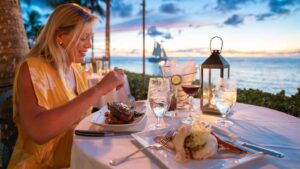 Woman eating diner at Latitudes at sunset Key - Top things to do in Key West - places to eat