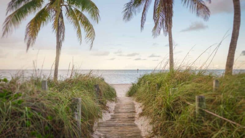 wooden boardwalk leading out to Smathers Beach - One of the best beaches in Key West