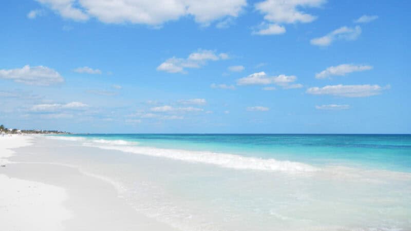 Aqua colored water and white sand on Tulum Beach - Places to stay