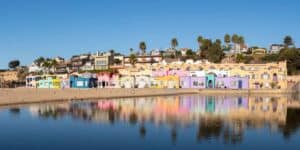 view of the Capitola Venetians with calm water in the foreground - Top photo spots on a California road Trip