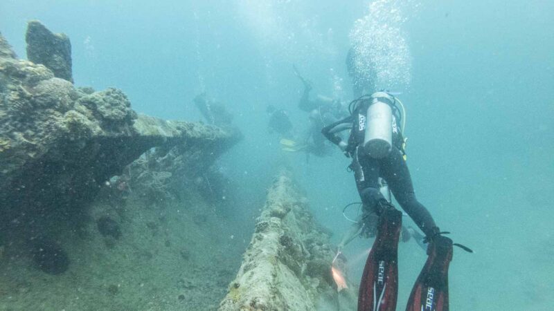 divers exploring WWII shipwrecks near Coron - Top tourist attractions in the Palawan Philippines
