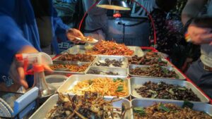 view of a food cart full of edible insects in Bangkok - Must Try