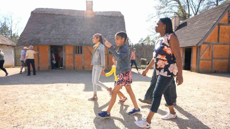 a Family walking through the James FOrt at Jamestown Settlement - Top things to do near Williamsburg