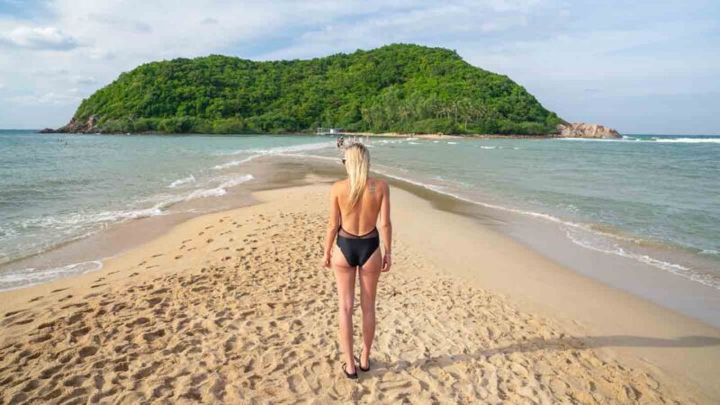 Woman standing on the beach in Koh Phangan Thailand - Top tourist attractions