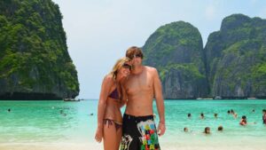 Couple standing on the beach in Maya Bay - Koh Phi Phi Leh - Top tourist attractions in Thailand