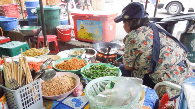 Thai Woman making Phad Thai on the strrets of Bangkok - Must Try Street food