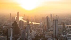 Golden sunset over the city of Bangkok viewed from a rooftop Sky Bar