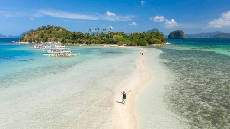 Man standing on Snake Island in El Nido - Top attractions in the Palawan