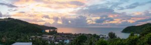 Panoramic photo of sunset on Koh Phangan Thailand as seen from a tree house bar