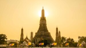 View of Wat Arun at sunset from the river boats in Bangkok - Top attractions