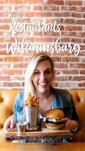 woman holding a burger - Pin for Best restaurants in Williamsburg Virginia