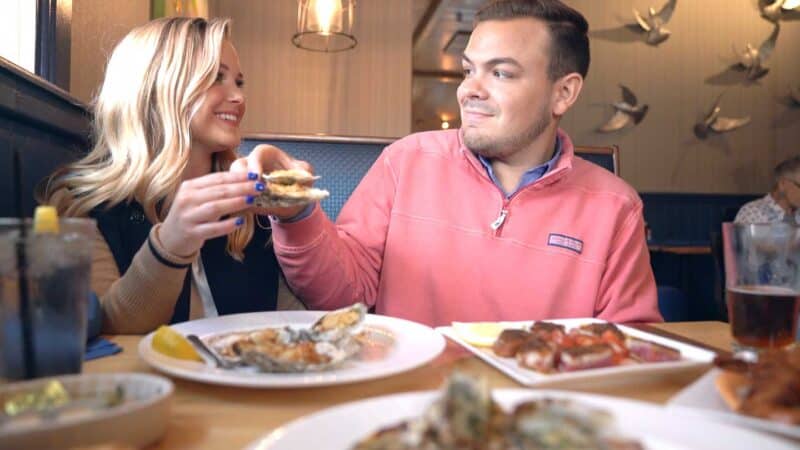 Couple eating Oysters at Fat Tuna a casual seafood restaurant in Williamsburg VA