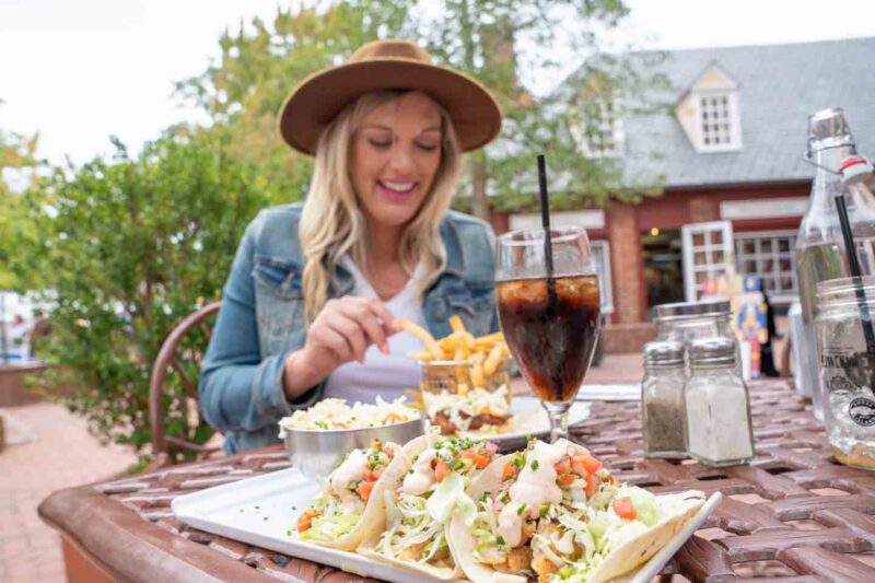 Woman dining on the patoo of The Trellis Bar and Grill - Top lunch spots in Williamsburg