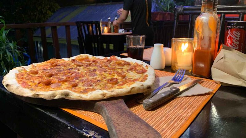 Pizza on a wooden board at Altrove Pizza in the Philippines
