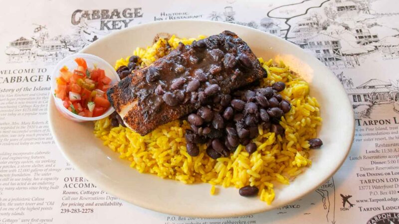 plate of fish with yellow rice and beans served at cabbage Key Restaurant - Top places to eat in Ft Myers area