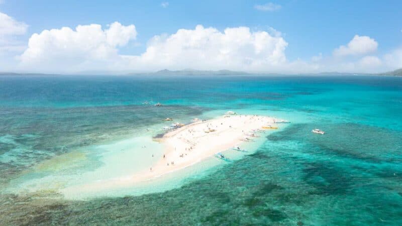 aerial drone photo of the sand bank island of Siargao - Naked Iasland with white sand and clear aqua blue water