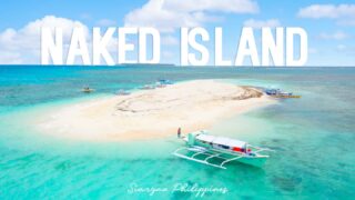filipino boats anchored at Naked Island in Siargao Philippines