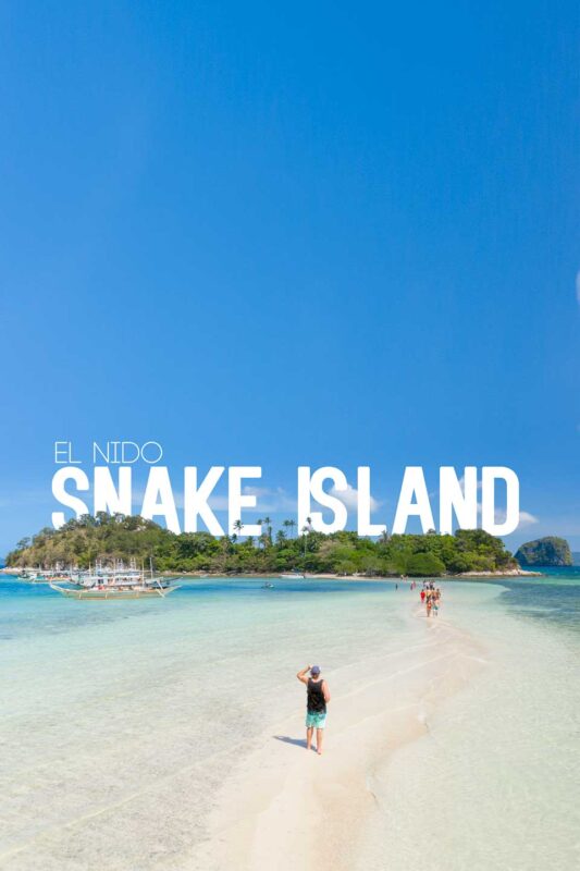 Man standing on a thin sand bar in the Philippines - Snake Island El Nido 