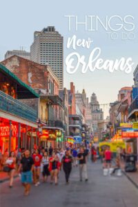 Sunset over Bourbon Street for a pinterest pin with text over "Things to do New Orleans"