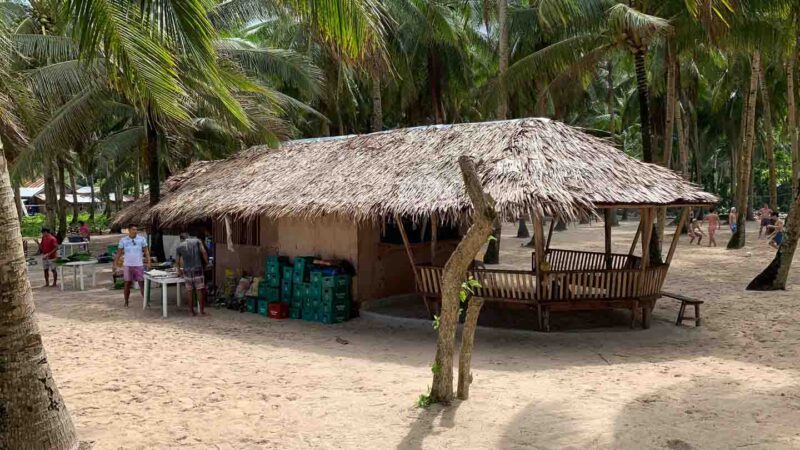 local restaurant with a thatched roof serving traditional Filipino foods on Daku Island