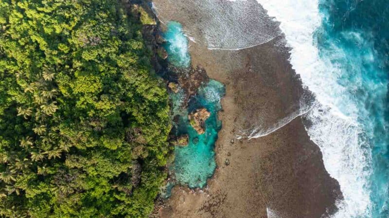 Drone photo looking straight down into the Magpupungko Rock Pool swimming and cliff jumping area