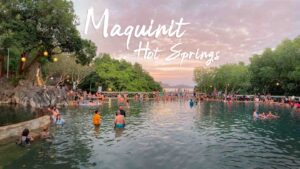 Pink and Orange sunset behind Maquinit Hot Springs in Coron - Featured Image with text